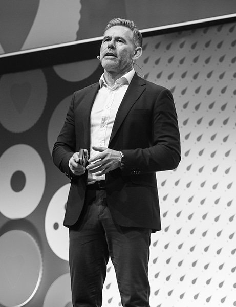 A male presenter on stage